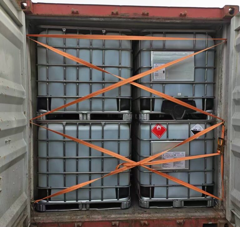 IBC totes strapped inside a shipping container